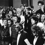 Some of a group of 45 music artists calling themselves "USA For Africa" recording "We Are The World" in Los Angeles, Calif.  Jan. 30, 1985. Bottom row, from left; Cyndi Lauper, Bruce Springsteen, James Ingram, Smokey Robinson, Ray Charles, Sheila E., June Pointer, Randy Jackson. Middle row, from left; Al Jarreau, Dionne Warwick, Lionel Richie, Kenny Rogers, Huey Lewis, Bob Dylan, John Oates, Ruth Pointer. Top row, from left; Daryl Hall, Steve Perry, Kenny Loggins, Jeffrey Osborne, Lindsay Buckingham, and Anita Pointer.  (AP Photo)