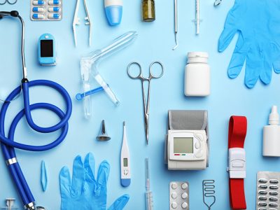 Flat lay composition with medical objects on color background